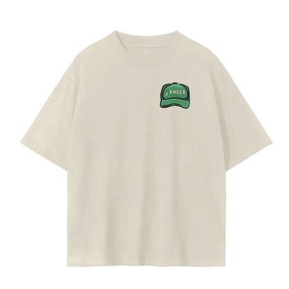 White crew neck t-shirt with a graphic print of a cartoonish ranger with a hat, surrounded by abstract designs and text that reads 'Only you can prevent slow play. The t-shirt displays a relaxed fit design with a drop shoulder.