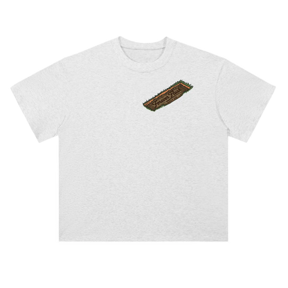White t-shirt with a brown divot logo on a white background