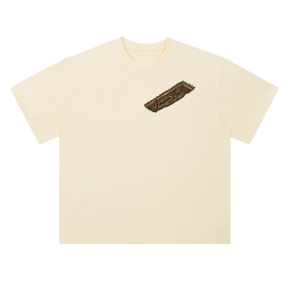 Beige t-shirt with a logo on the chest against a white background